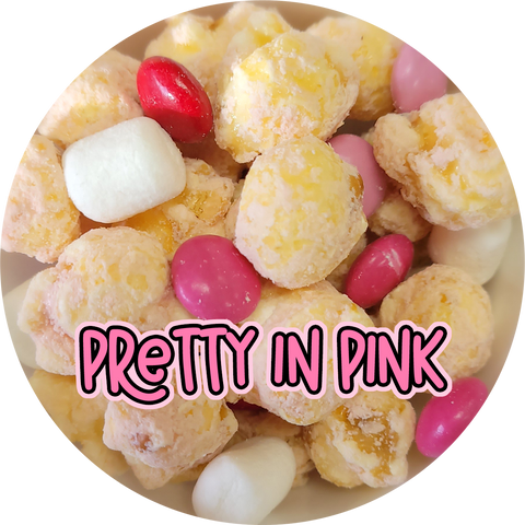 Blush colored pink popcorn with Valentine candies and mini marshmallows.