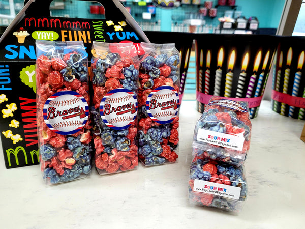 Colorful popcorn bags with personalized labels.